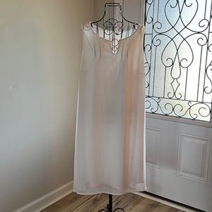 Tacera white dress with metal details.